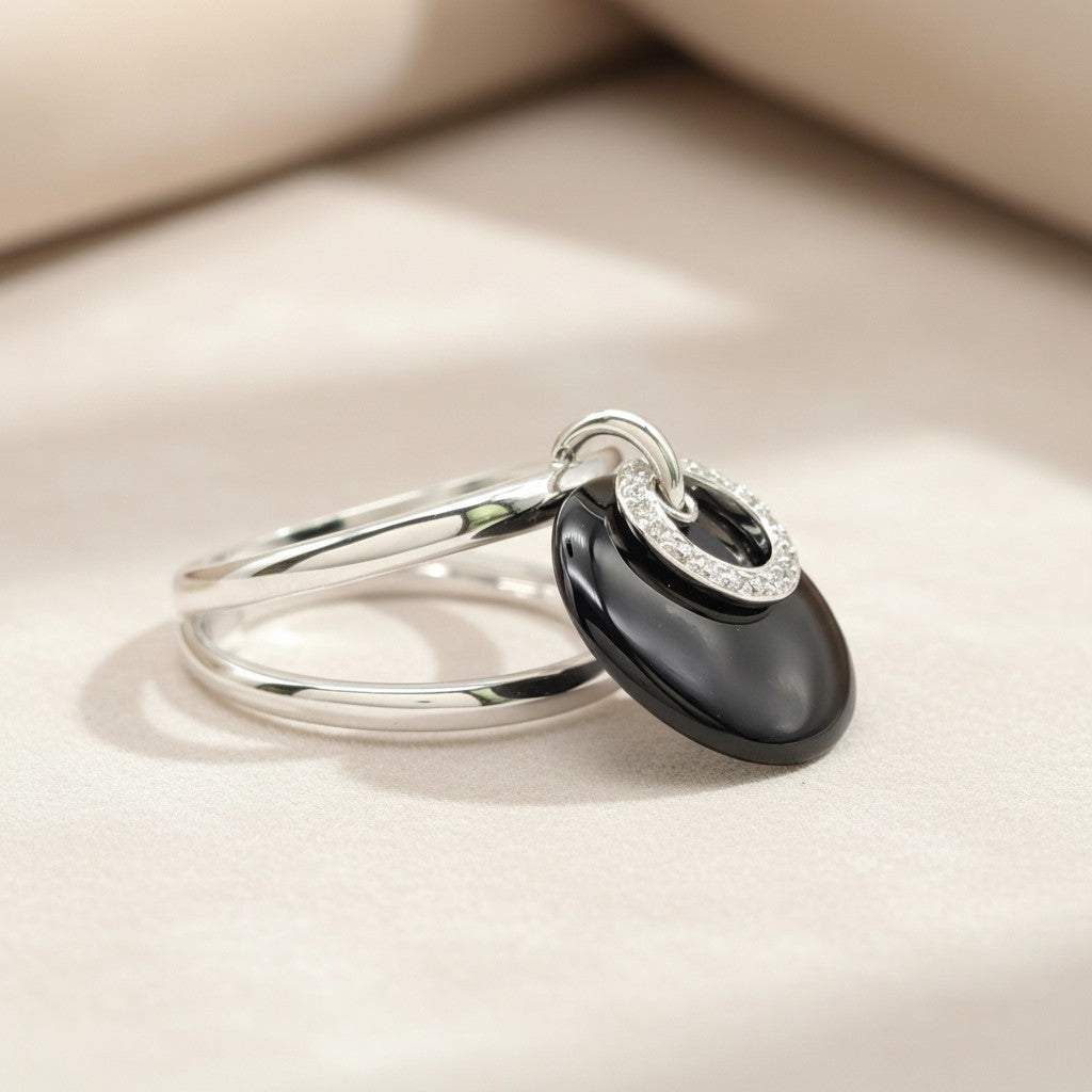 Gold ring with onyx and diamonds