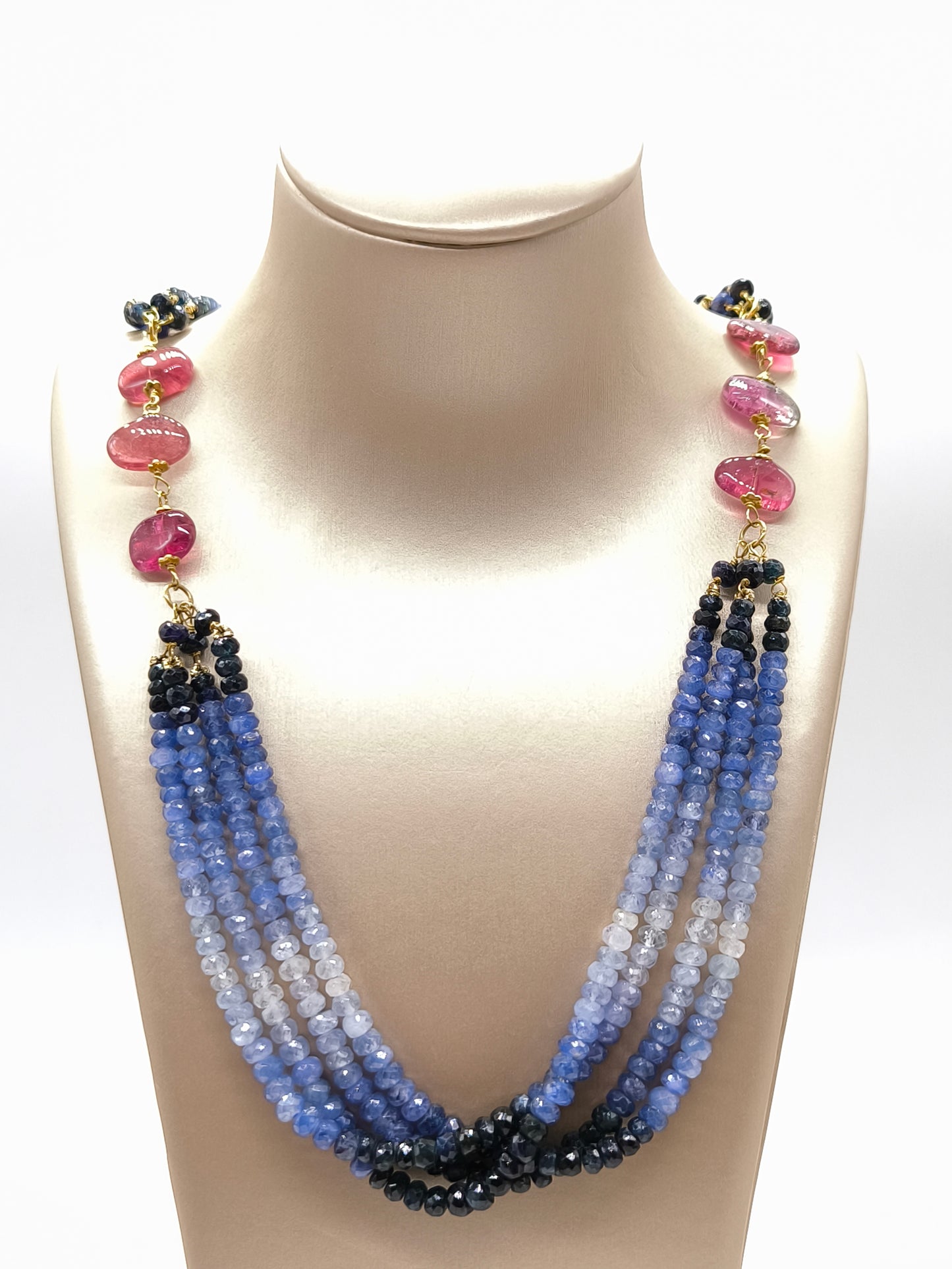 Multi-strand necklace with scaled sapphires and tourmalines