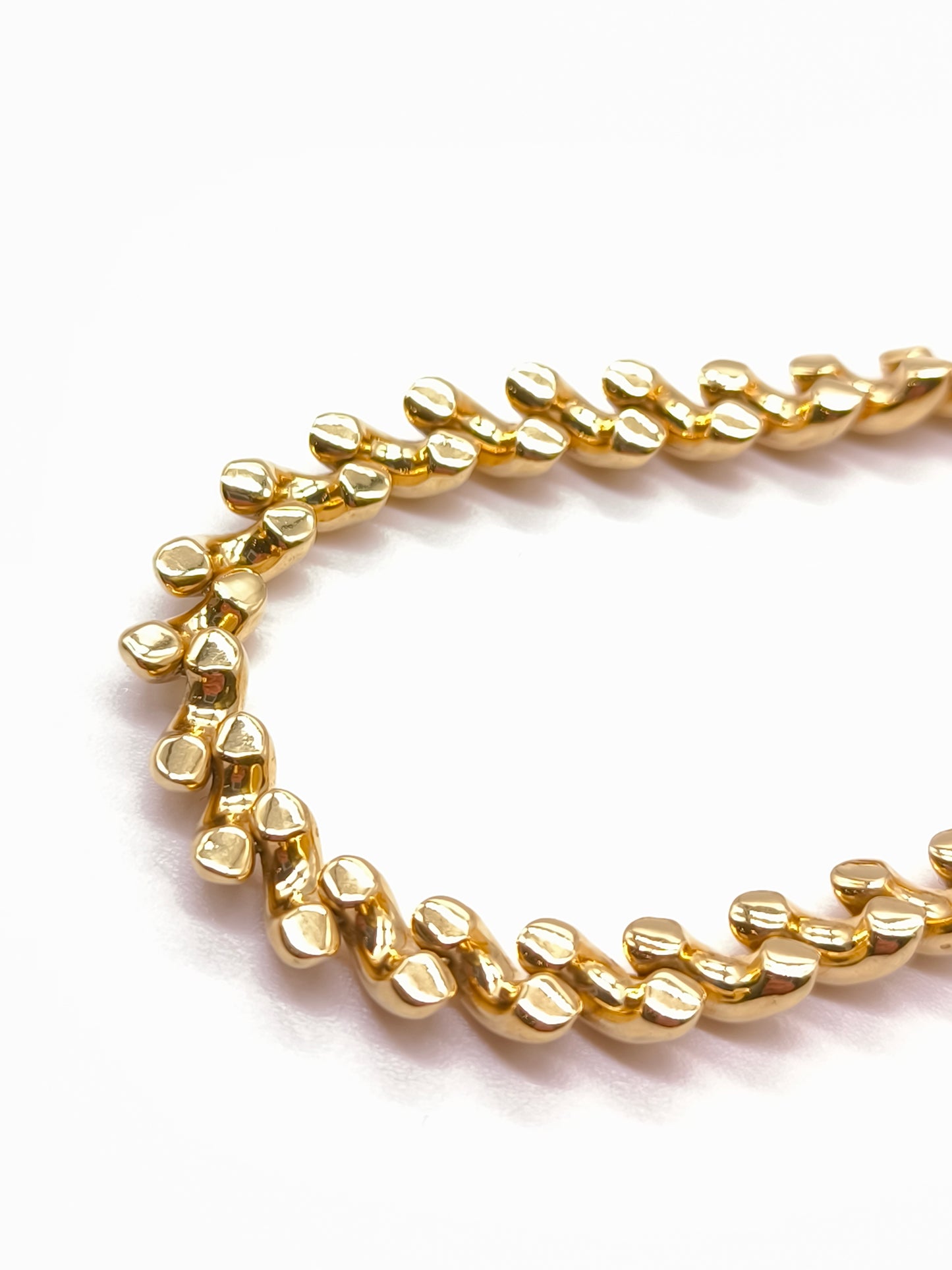 Yellow gold torcion mesh bracelet