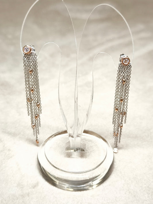 Silver earrings with dangling zircons