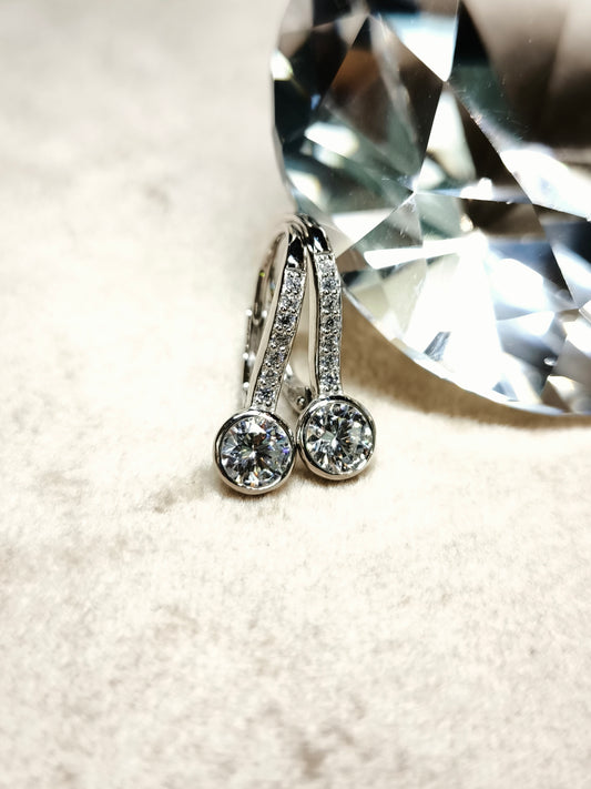 Silver earrings with semi-pendant zircons