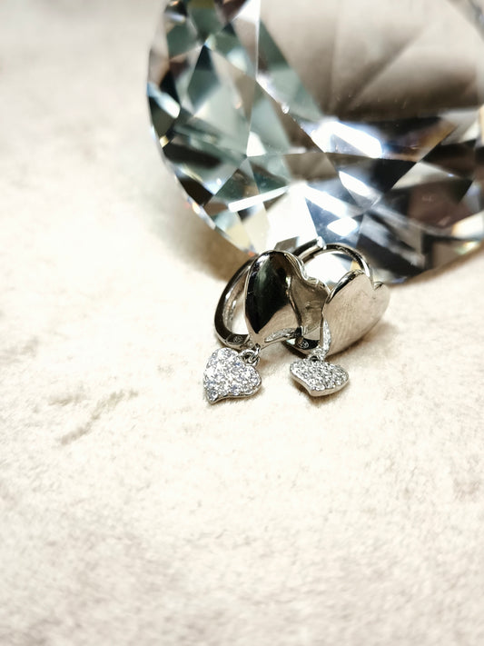 Silver earrings with heart zircons