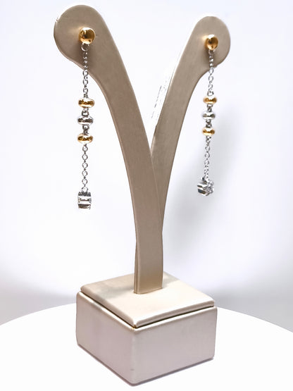 Gold earrings and dangling diamonds