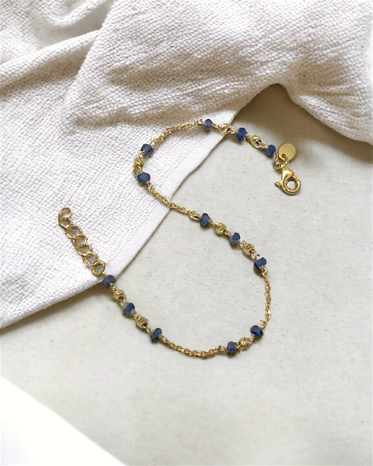 Yellow gold bracelet with blue stones