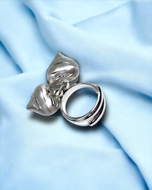 Silver ring with hanging hearts