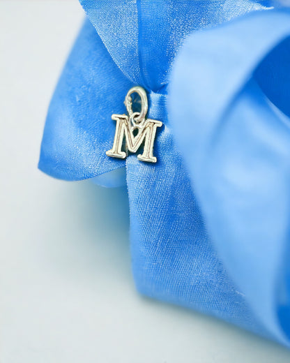 White gold block letter M pendant