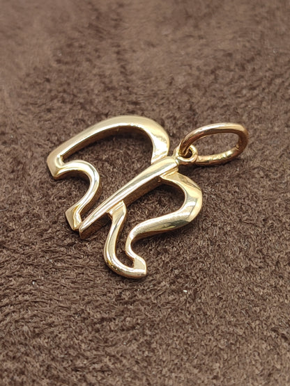 Gold perforated elephant pendant