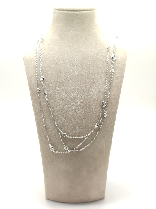 Long silver necklace with 3-strand zircons