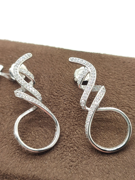 Silver earrings with dangling zircons