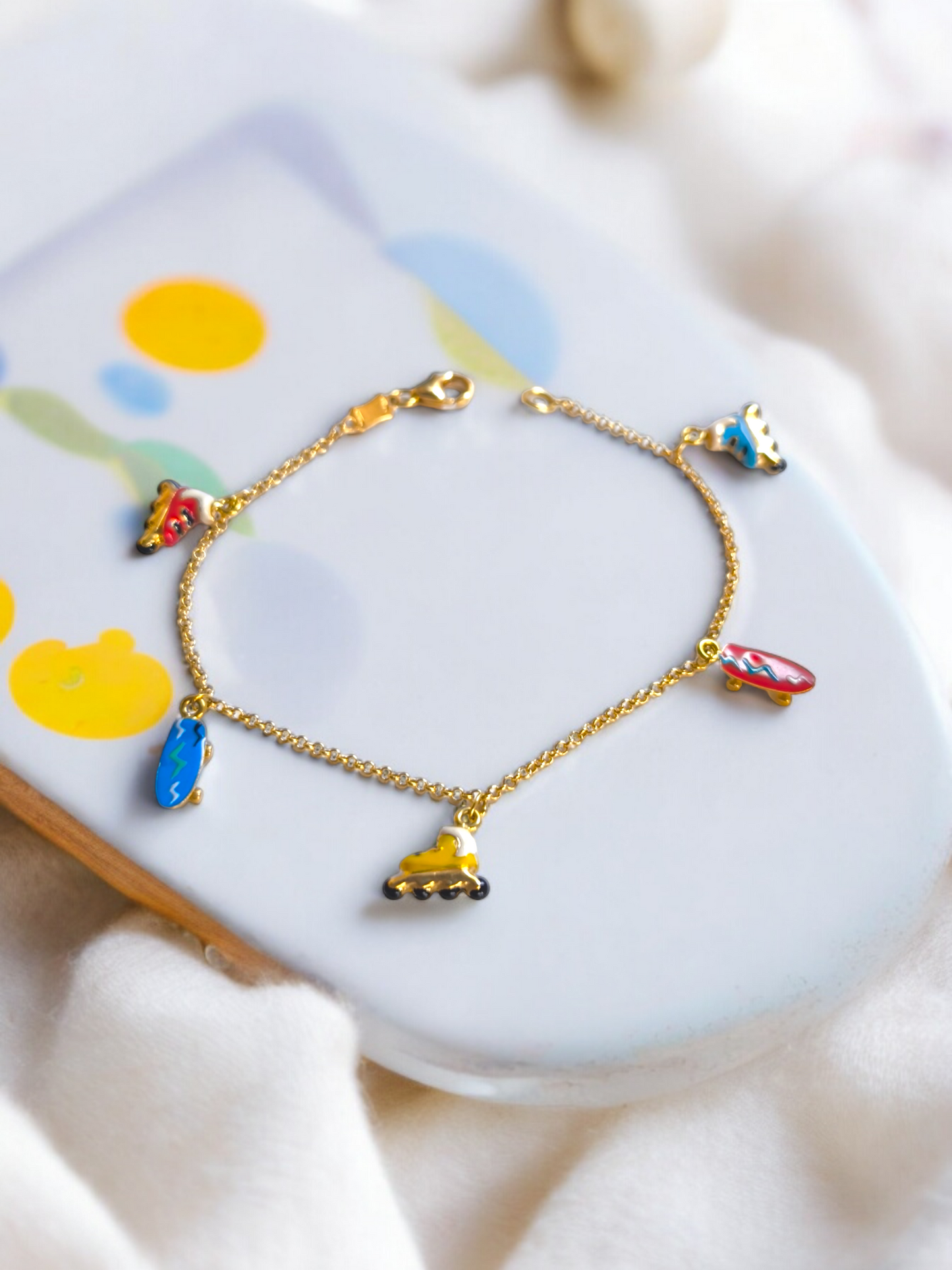 Yellow gold roller and skate enamel bracelet