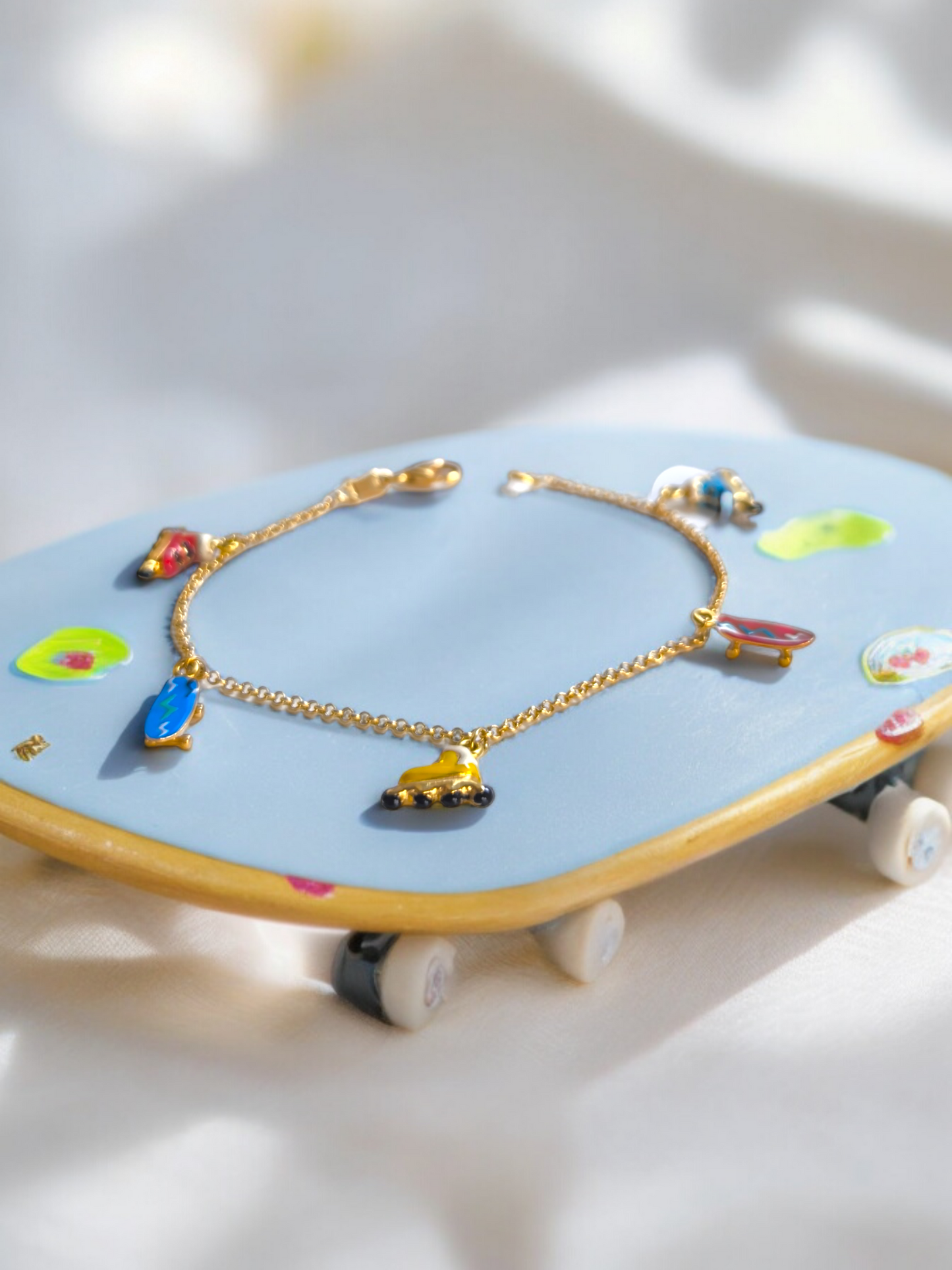 Yellow gold roller and skate enamel bracelet