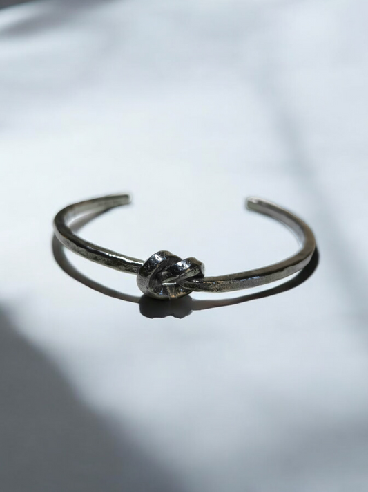 Rigid silver knot bracelet