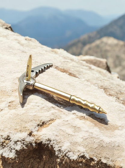 Gold tip in the shape of an Alpine ice axe