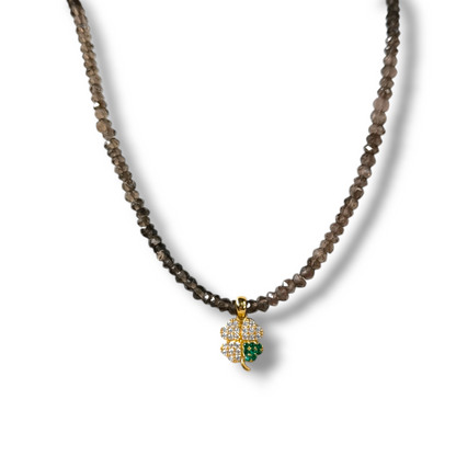 Four-leaf clover necklace in gold and semi-precious stones