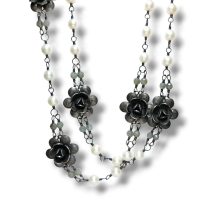 Long silver filigree necklace with pearls, flowers and quartz