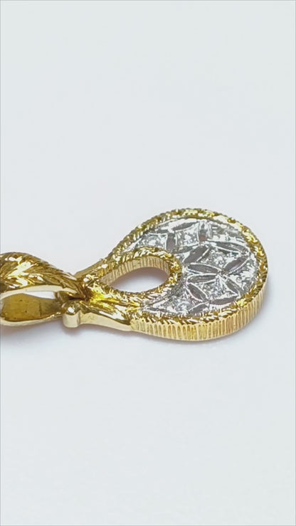 Hand-engraved gold pendant with diamonds