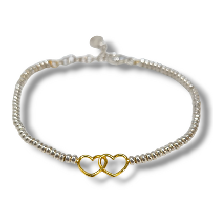 Bracciale Bracciale in argento con virolette bianche con cuori traforati dorati centrali - Gioielli Pavan