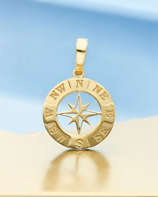 Gold compass rose pendant