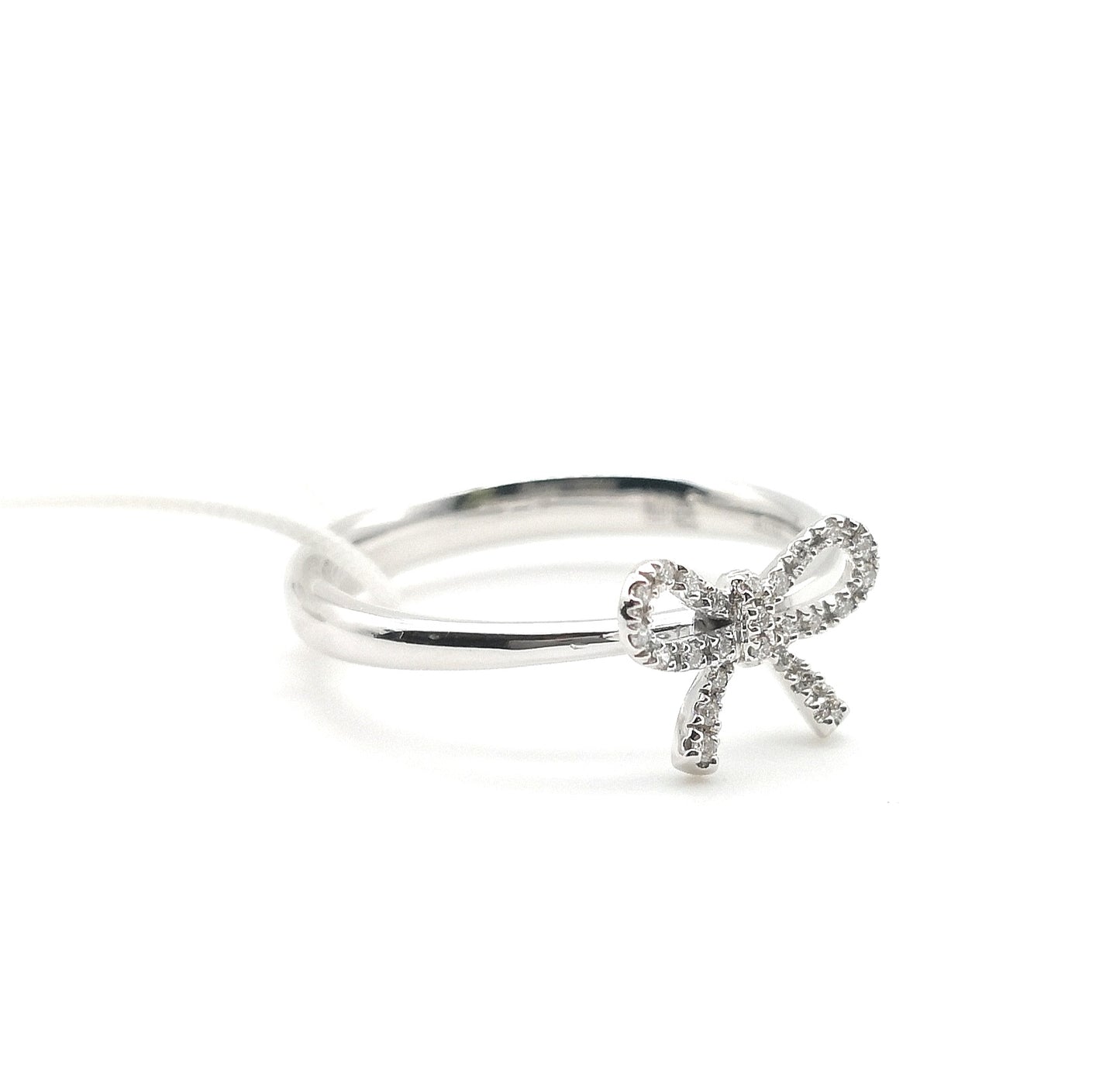 White gold ring with bow diamonds