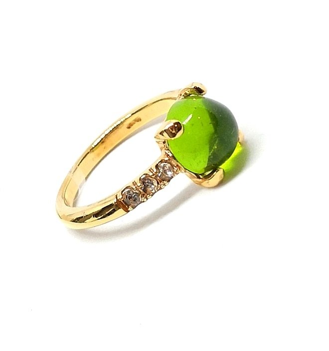 Silver ring with green stone and zirconia