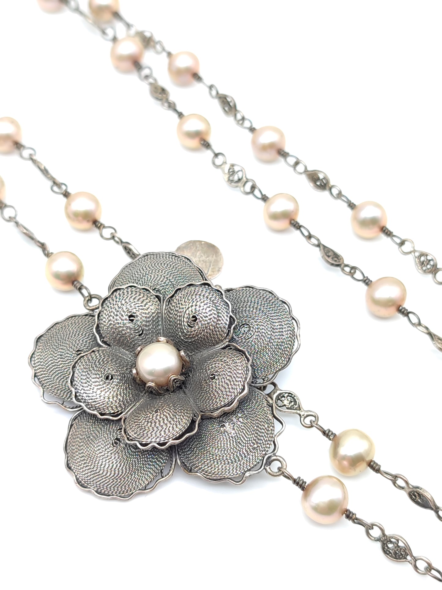 Long silver filigree necklace with pearls and flower