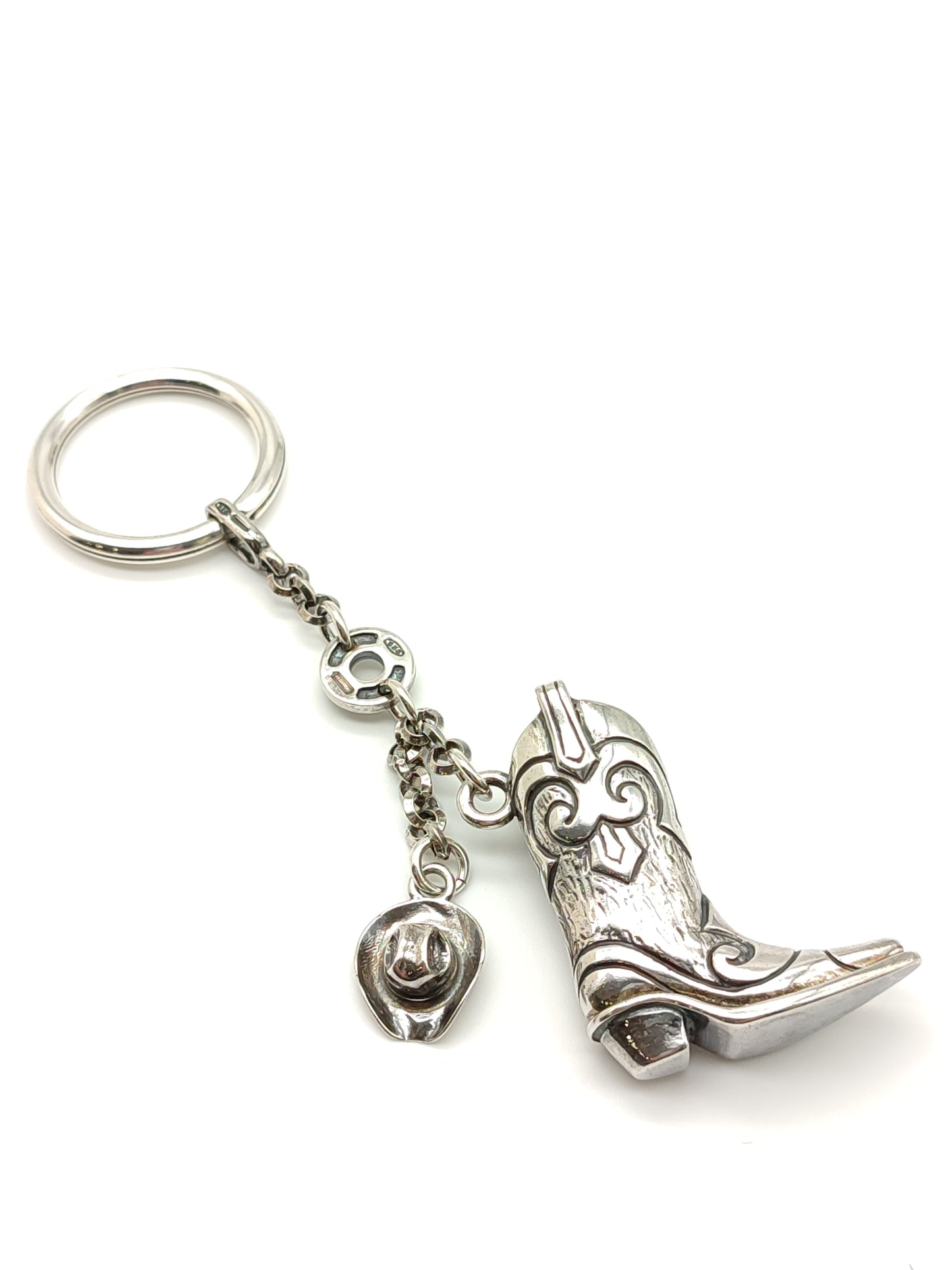 Silver keychain with cowboy boot and hat