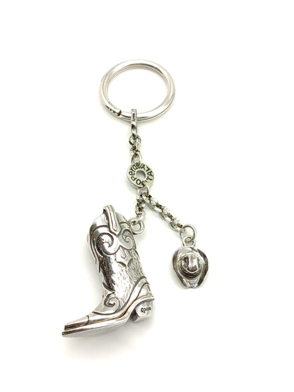 Silver keychain with cowboy boot and hat