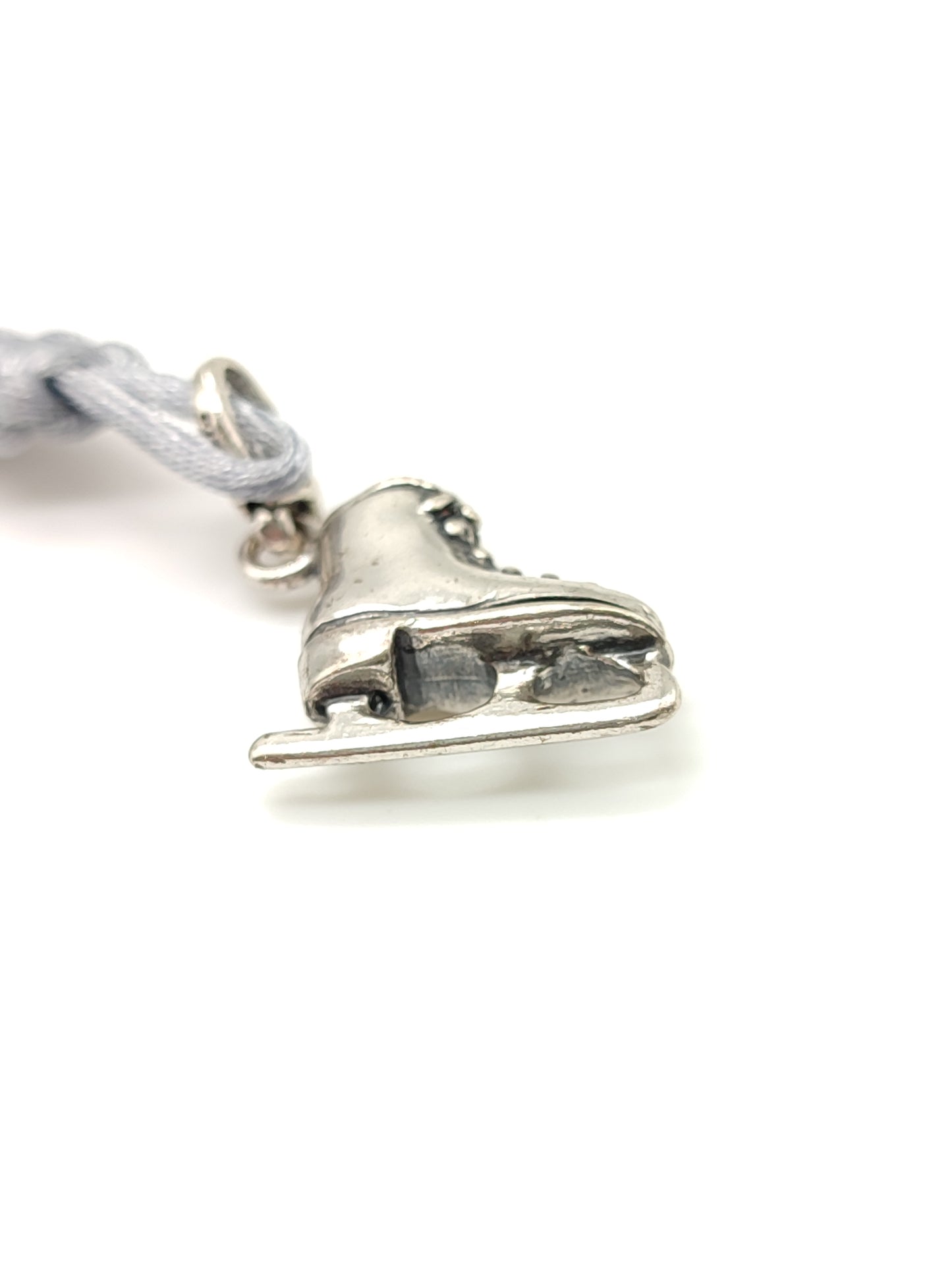 Silver ice skate key ring with satin cord