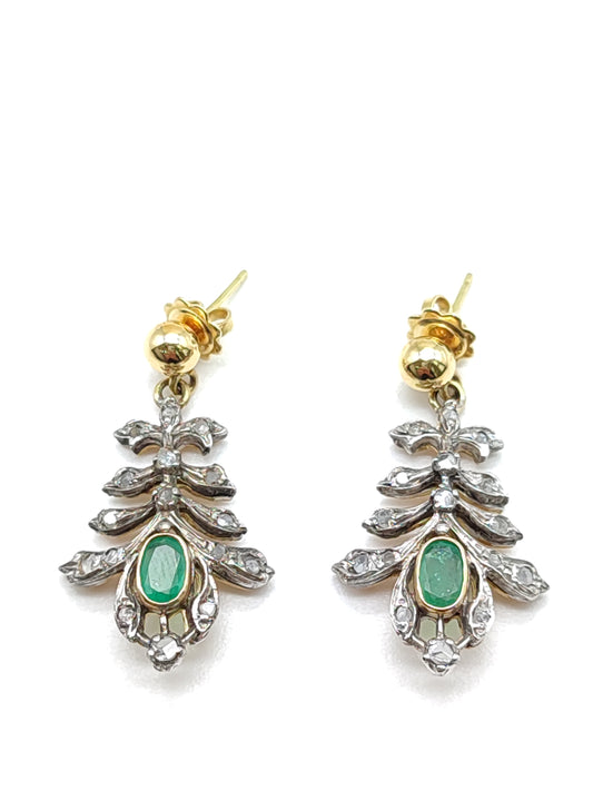 Silver and gold earrings with diamonds and emeralds