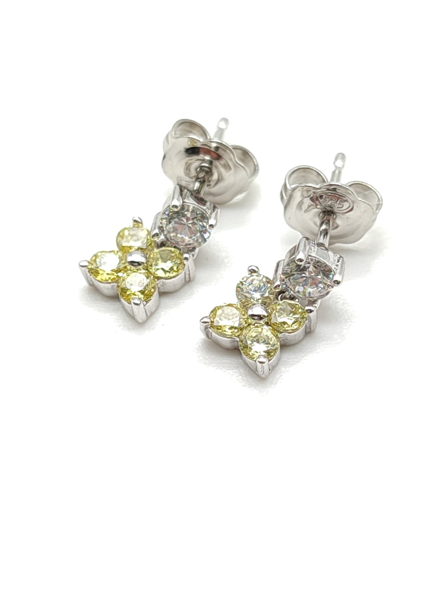 Silver lobe earrings with yellow zircons