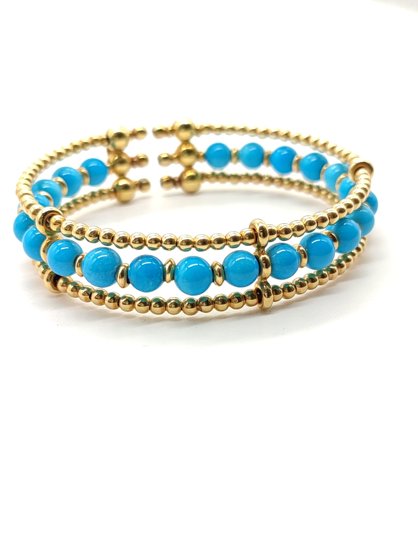 Gold bangle bracelet with turquoises