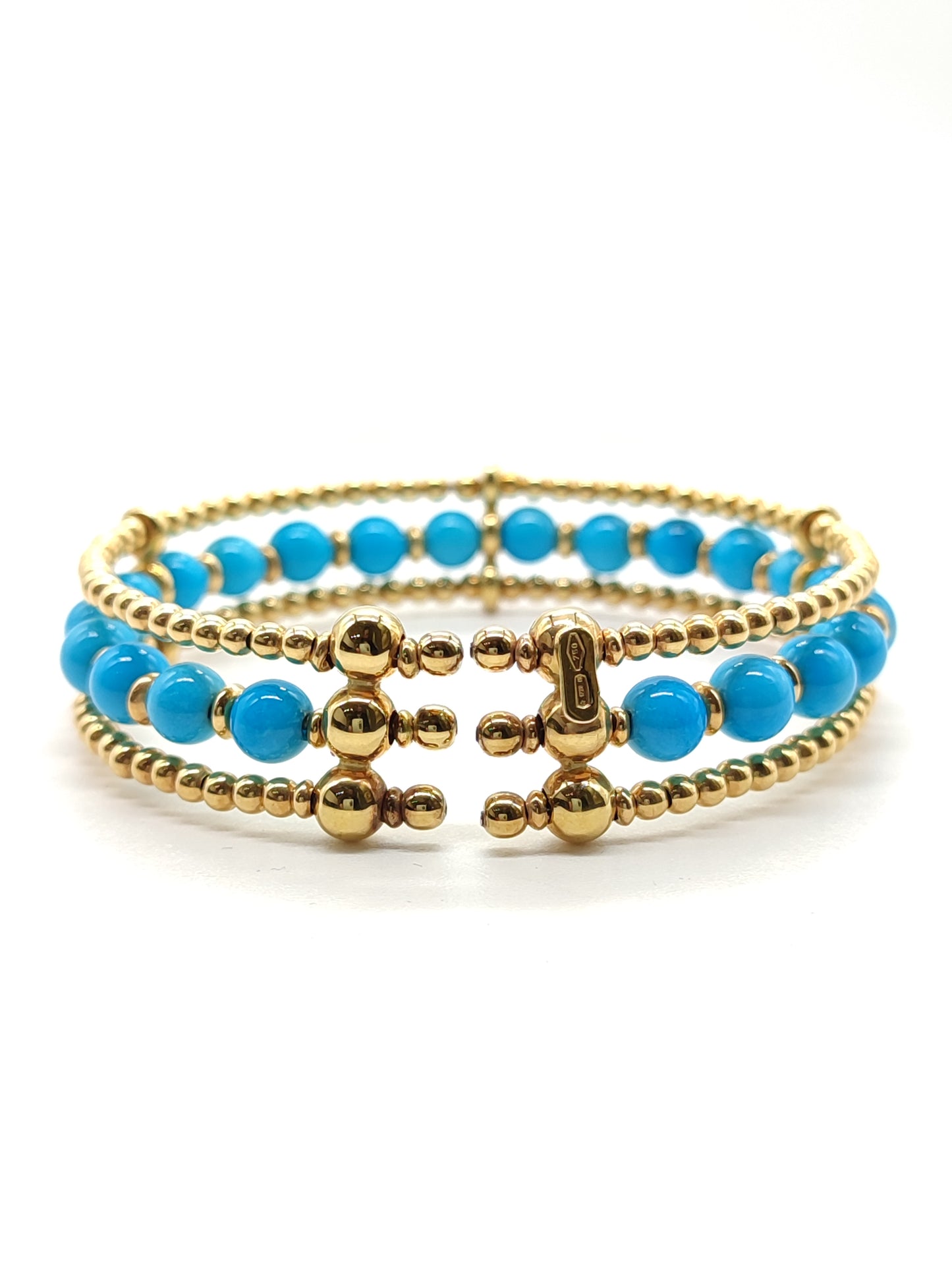 Gold bangle bracelet with turquoises