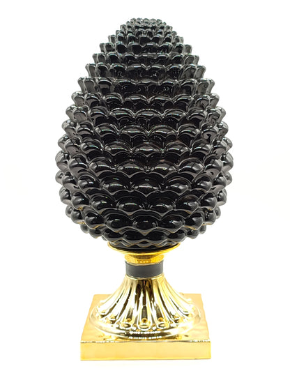 Medium black and golden pine cone