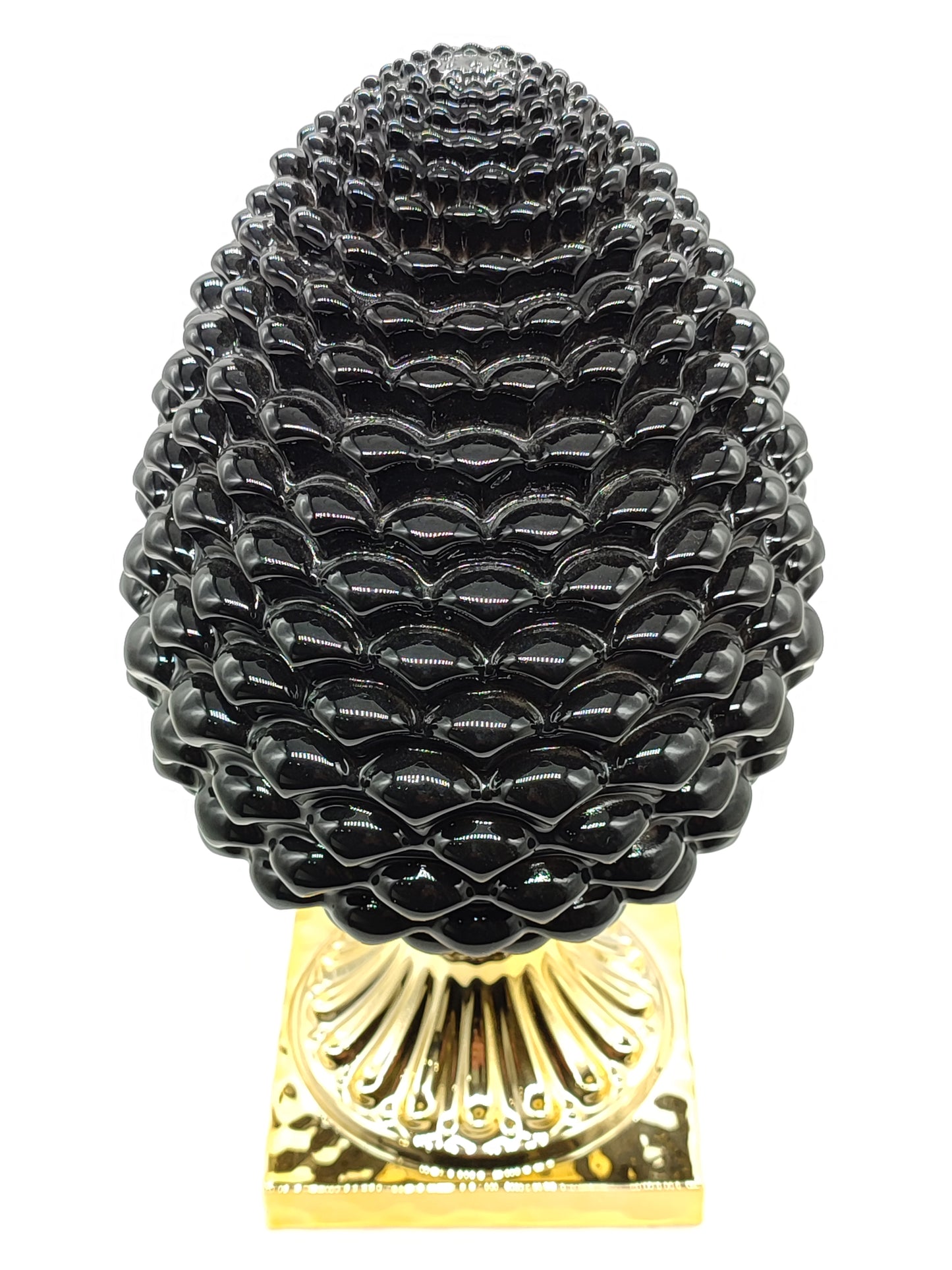 Medium black and golden pine cone