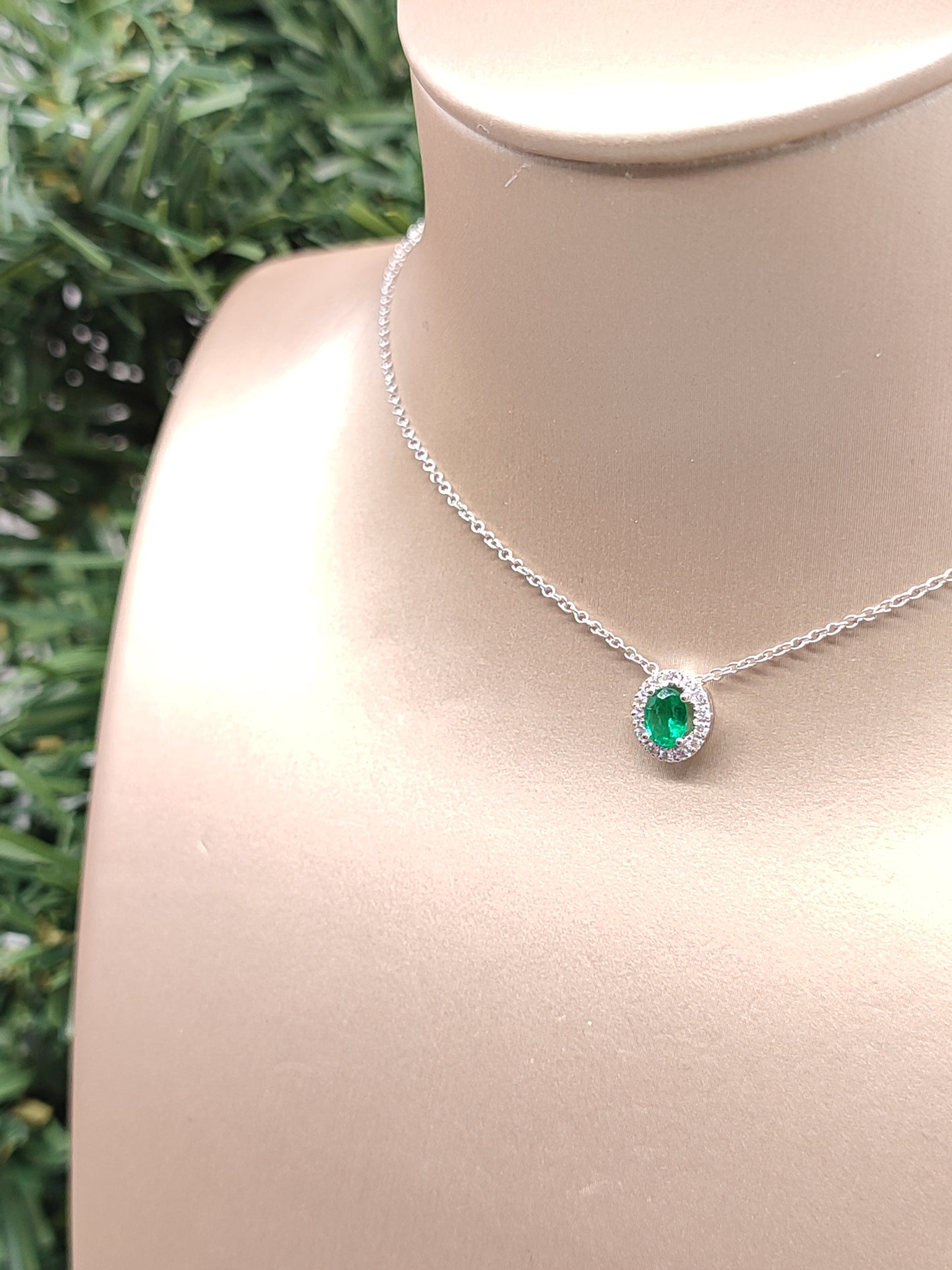 White gold necklace with emerald
