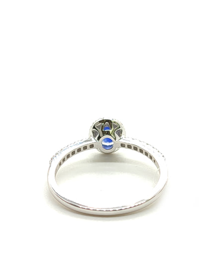 Gold solitaire ring with sapphire and diamonds