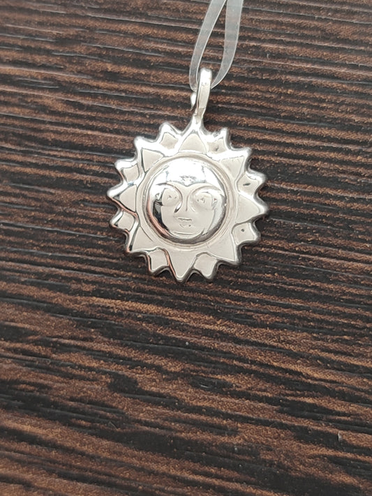 White gold sun pendant