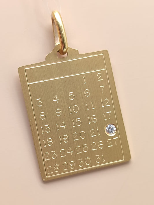 Yellow gold medal pendant with calendar and diamond