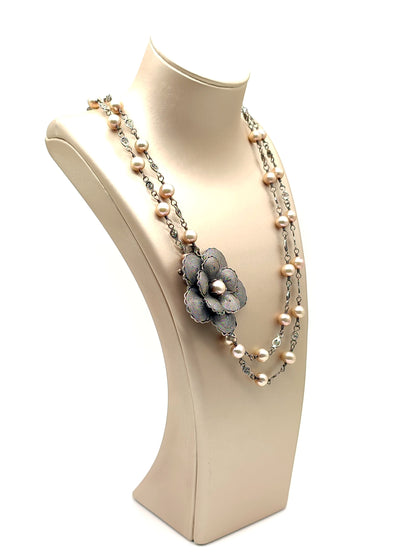 Long silver filigree necklace with pearls and flower