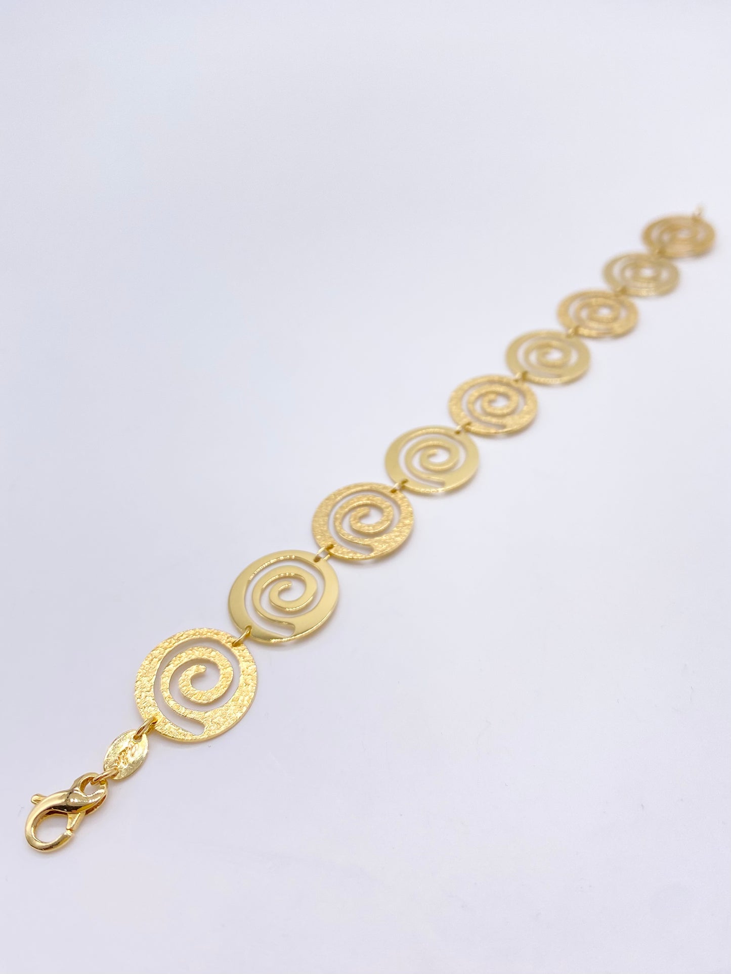 Yellow gold bracelet with spirals